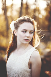 Caucasian teenage girl standing in forest - BLEF05823