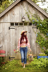 Gardener picking flowers in garden - BLEF05979