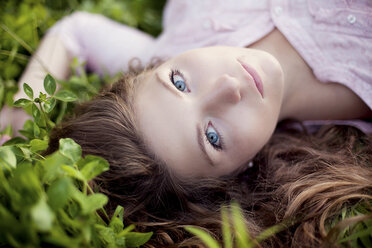 Close up of woman laying in grass - BLEF06001