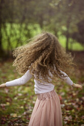 Caucasian girl playing in autumn leaves - BLEF06173