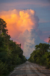 Beautiful illuminated cloud above a dirt track, Pantanal, Brazil - RUNF02369
