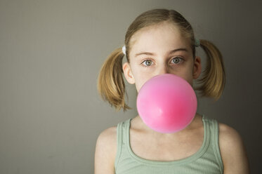 Caucasian girl blowing gum bubble - BLEF06266