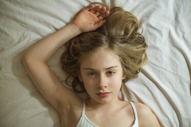 Serious Caucasian girl laying on bed - BLEF06269