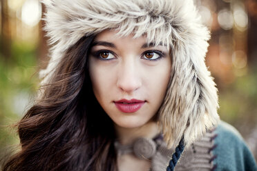 Close up of serious woman wearing furry hat - BLEF06331