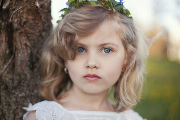 Serious Caucasian girl near tree - BLEF06418