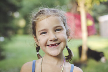 Caucasian girl smiling in backyard - BLEF06459