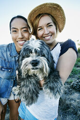 Close up of women smiling with dog - BLEF06593