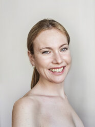 Portrait of smiling woman, strapless, white background - PNEF01518