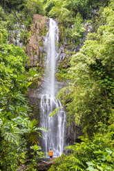 Man looking at waterfall, Wailua falls, Maui, Hawaii, USA - FOF10833