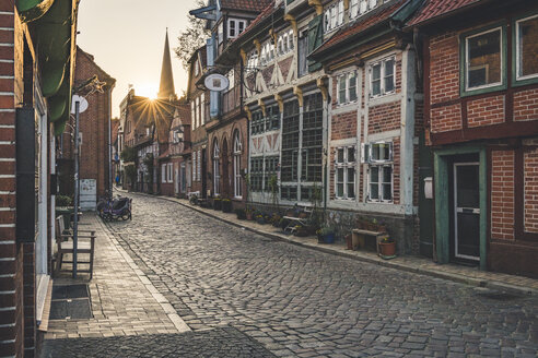 Half-timbered houses at an alley at sunset, Lauenburg, Schleswig-Holstein, Germany - KEBF01255