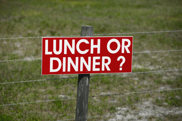 Sign on a Barbwire Fence - MINF11199