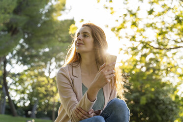 Young redheaded woman in a park - AFVF03168