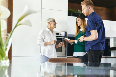 Couple shopping for a new kitchen in showroom - ZEDF02418