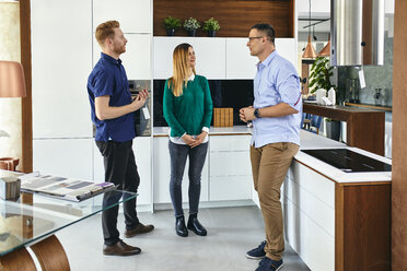 Couple shopping for a new kitchen in showroom - ZEDF02437