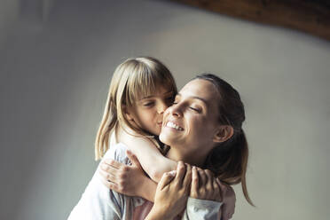 Mother and daughter playing at home, piggyback - JSRF00189