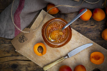 Apricot jam and apricots on dark wood - LVF08085