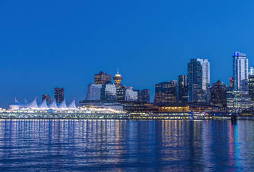 Waterfront skyline illuminated at night, Vancouver, British Columbia, Canada, - MINF11761