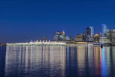 Waterfront skyline illuminated at night, Vancouver, British Columbia, Canada, - MINF11762