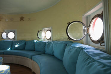 Port hole windows in round lighthouse living room - MINF12046