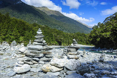 Man made stone pyramids at the Blue Pools, Haast Pass, South Island, New Zealand - RUNF02620