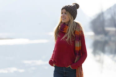 Young blond woman at a lake in winter - JSRF00203