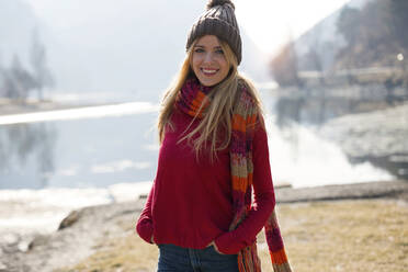 Young blond woman at a lake in winter - JSRF00204