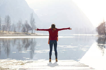 Young blond woman at a lake in winter - JSRF00208