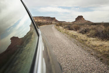 Close up of car window driving through desert landscape, Chaco Canyon, New Mexico, United States - MINF12134