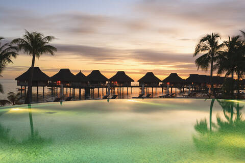 Palm trees and tropical resort, Bora Bora, French Polynesia stock photo