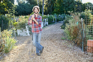 Caucasian man standing in garden - BLEF06810