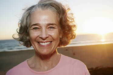 Caucasian woman smiling at beach - BLEF06978