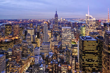 Aerial view of highrise buildings in cityscape at twilight - MINF12383