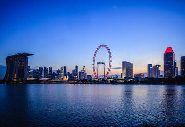 Singapore city skyline under sunset sky, Singapore, Singapore - MINF12501