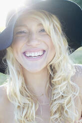 Caucasian woman wearing floppy hat - BLEF07067