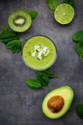 Green smoothie with avocado, spinach, kiwi and lime, coconut flakes and black sesame - LVF08105