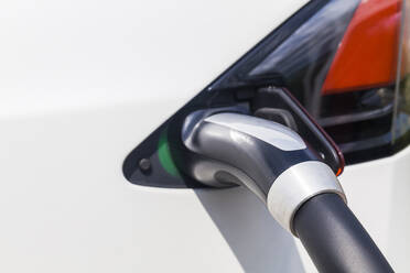 Charging of an electric car, close-up - TCF06094