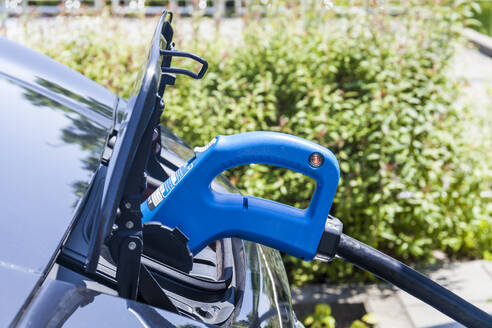 Charging of an electric car, close-up - TCF06098