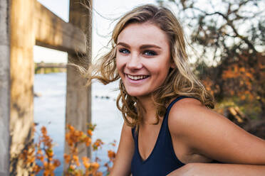 Caucasian teenage girl smiling outdoors - BLEF07249