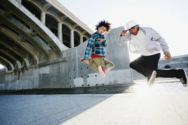 Men break dancing under overpass - BLEF07397