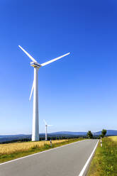 Wind wheel at empty road, Hesse, Germany - PUF01629