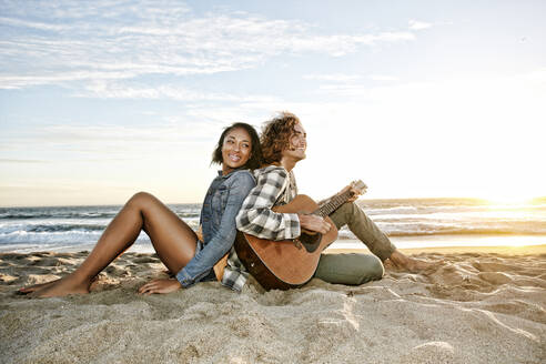 Couple relaxing together on beach - BLEF07626