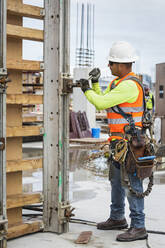 Hispanic worker at construction site - BLEF07643