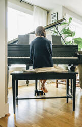 Mixed race girl playing piano - BLEF07782