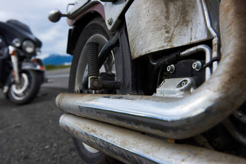 Exhaust pipes of motorcycle covered in dirt - ISF21673