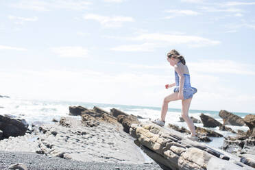 Girl exploring beach - CUF51483