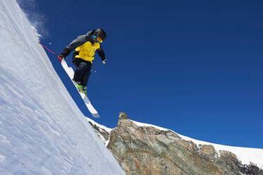 Skier moving down slopes, Saas-Fee, Valais, Switzerland - CUF51546