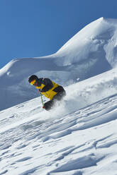 Skier moving down slopes, Saas-Fee, Valais, Switzerland - CUF51552