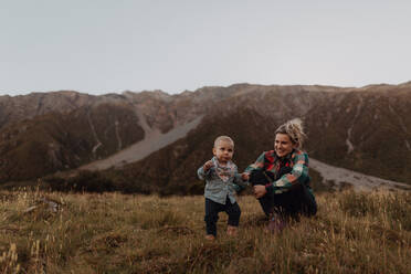 Mother and baby exploring wilderness, Wanaka, Taranaki, New Zealand - ISF21850