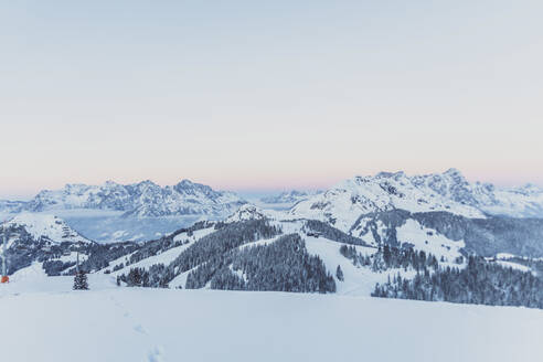 View over snowy mountains at dusk, Saalbach Hinterglemm, Pinzgau, Austria - MMAF01066