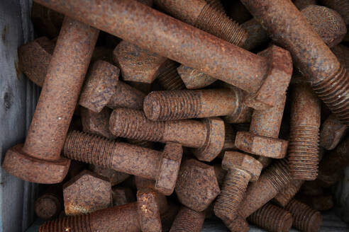 Rusty bolts on construction site, overhead close up - ISF21958